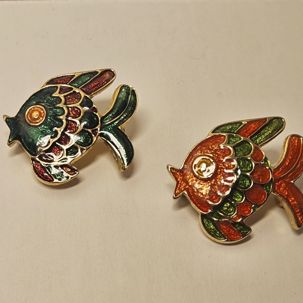 Ivana goldtone enameled set of 2 fish pins.
